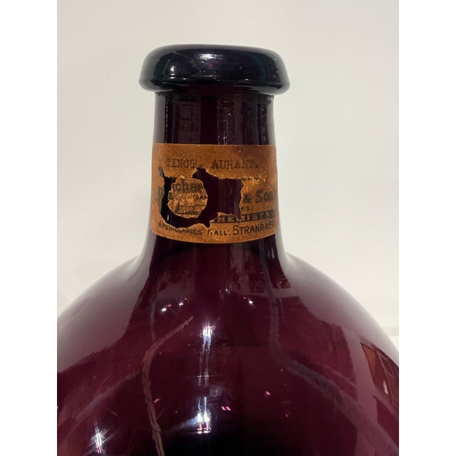 Scottish Apothecary Amethyst Glass Bottles A matched pair of Scottish apothecary display bottles in deeply saturated...