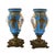 These Blue French Sèvres Vases are elegant pieces, featuring a rich cobalt glaze with delicate hand-painted motifs and...