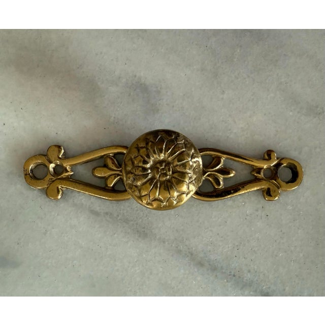 Set of 7 vintage brass cabinet or drawer pulls made by SRG in Japan. Includes original screws. Screw hole to screw hole...