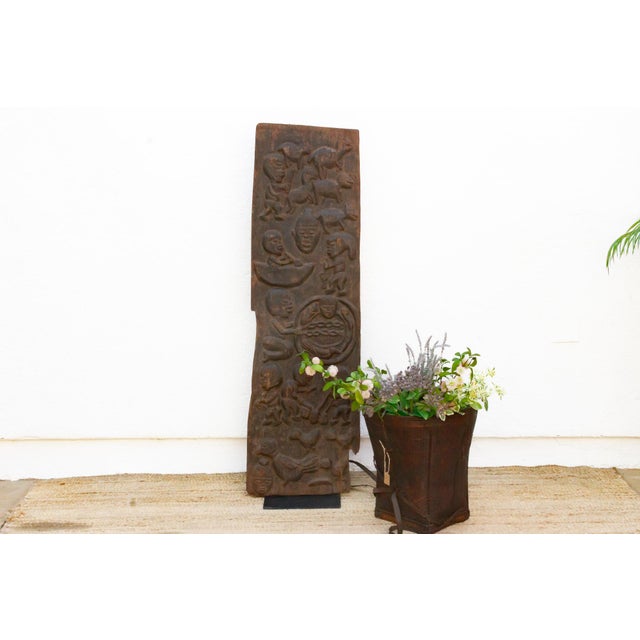 This door reflects the figurative narrative tradition of Yoruba carving from southwestern Nigeria, where carved doors...