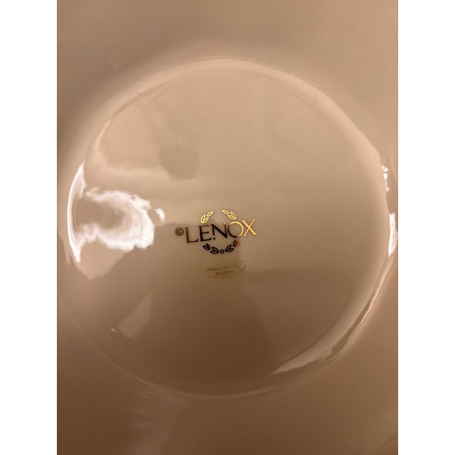 Elegant Lenox embossed ceramic vase featuring raised floral relief detailing, ribbed body design, and delicate gold trim...