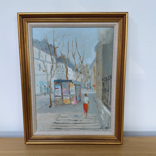 Charming original Parisian street scene painting by artist Jean Lay Sauls, capturing the understated romance of everyday...