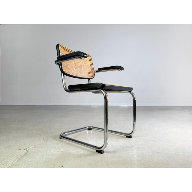 Beautiful Thonet S64V cantilever chair with armrests for sale. The chair was designed by Marcel Breuer at the beginning of...
