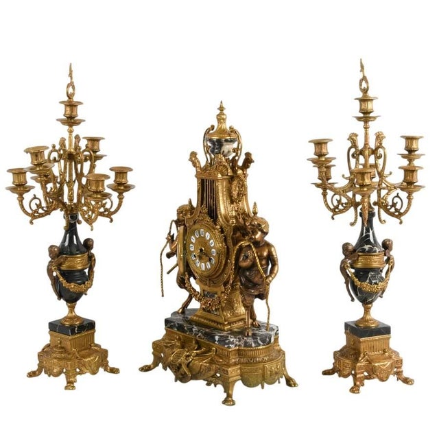 his magnificent Italian mantel clock garniture set is an opulent three-piece ensemble that embodies the grandeur of...