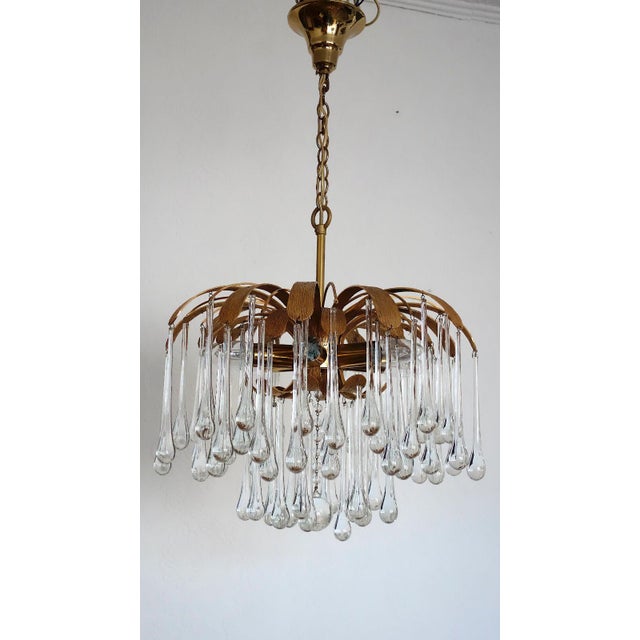 Brass and Crystal Drop Chandelier from Palwa, 1960s, in Very Good conditions. Designed 1960 to 1969 This piece has an...