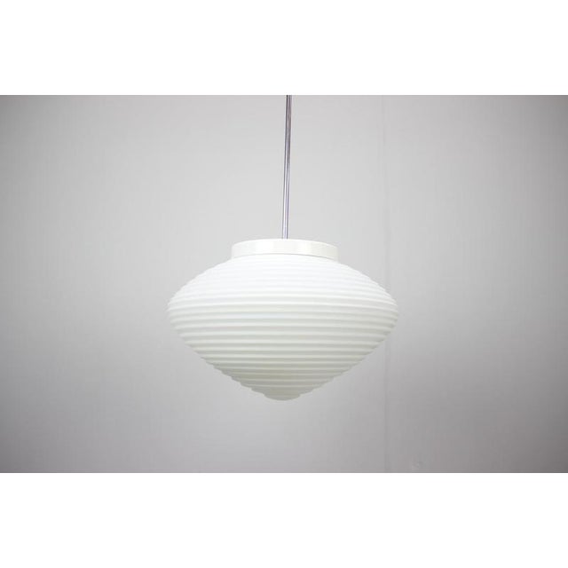 Large pendant lamp by Napako, produced in Czechoslovakia during the 1970s. This elegant Mid-Century Modern fixture...