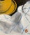 1990s oil on canvas board of a yellow tea or coffee cup and saucer. Signed with initials lower right. The painting has...