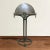 An incredible fine quality early 20th century Vienna Secession bronze table lamp with a removable dome shade supported by...