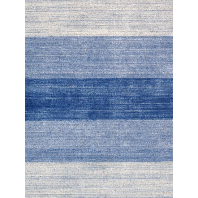 The tribal motifs of this traditional area rug collection reflect the soft pile and unparalleled elegance of classic...