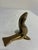 A charming brass sea lion with a graceful upturned head and outstretched flippers. Its clean, streamlined form and golden...