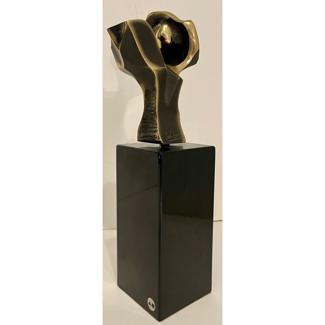 Beautiful abstract bronze sculpture in a brutalist style. Made of solid bronze on black marble stand. Signed Jose' Lucas...