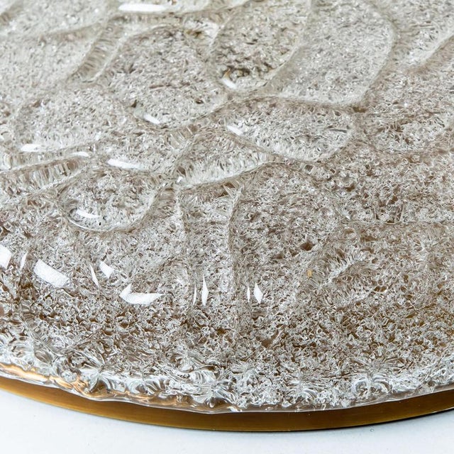 A high-end wrinkled glass flush mount by hillebrand. Manufactured in the late 1960s-early 1970s. The brass ring holds a...