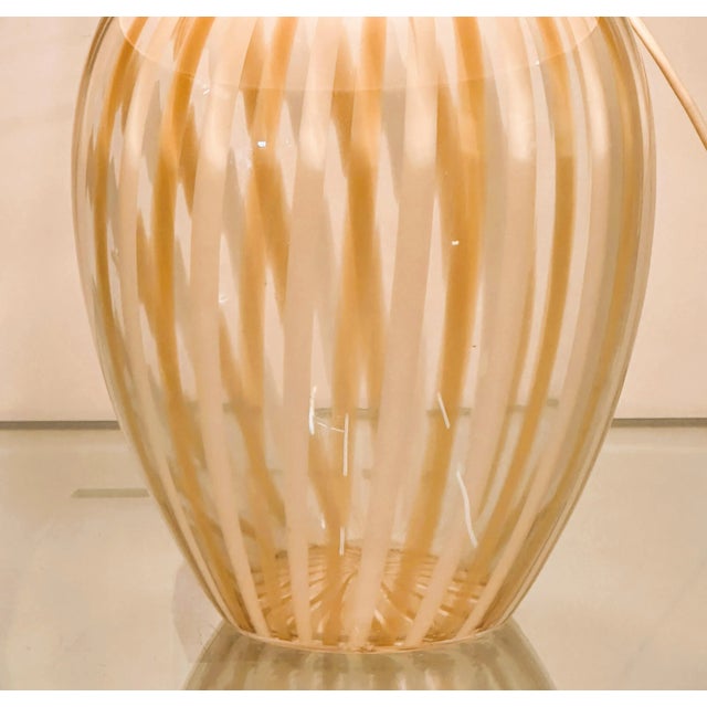 Lamp base is 26cm diameter, 37cm high. Lamp shade is 58cm wide. Sourced in Italy, this striking 1980s Murano table lamp...