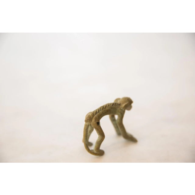 :: Vintage handmade oxidized bronze monkey holding banana. Circa mid 20th century and possibly older, this piece has such...