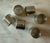 Set of 6 silver metal napkin rings with a hammered detail and round edge. Unmarked, but resemble Royal Selangor Pewter...