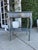 Charming vintage-inspired accent table featuring a distressed slate blue finish with subtle teal undertones and hints of...