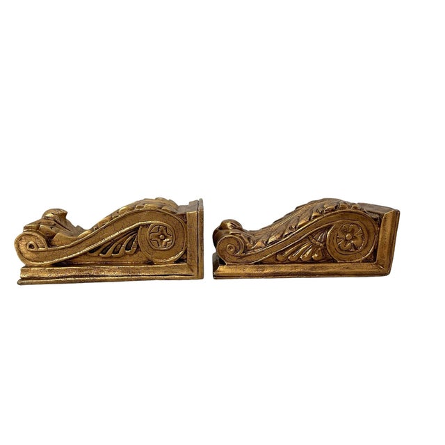 This set of 2 solid wood gold gilt hand carved corbels wall bracket shelves exudes an antique style and charm, perfect for...