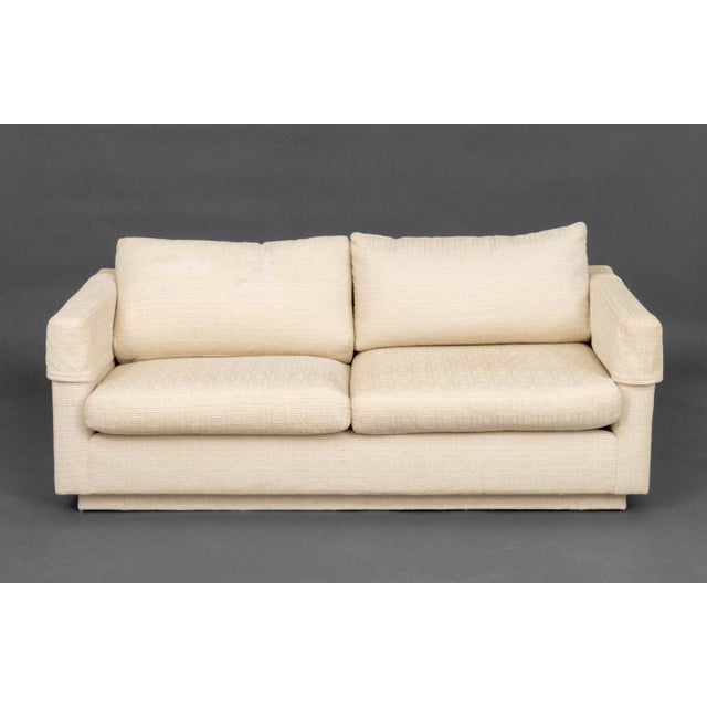 Modern White Upholstered Two-Seat Sofa. 28" H x 62.75" W x 35" D; seat: 15" H. Provenance: From the Estate of Gerard...