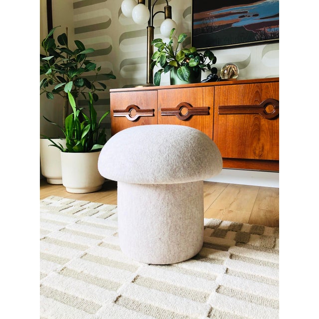 A handmade mushroom shaped ottoman, upholstered in "Ivory Melange" wool fabric. This melange fabric has beautiful...