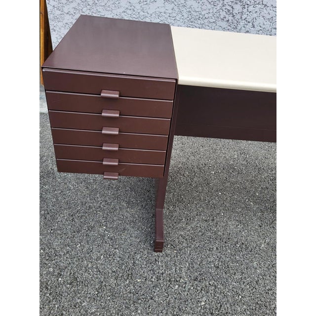 Seize the opportunity to acquire a true piece of design history. This vintage olivetti synthesis desk was designed by the...