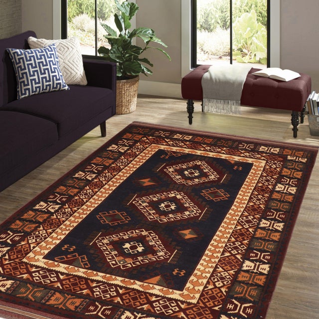 Enhance your home with the timeless craftsmanship of a hand-knotted Kargahi wool rug, celebrated for its tribal artistry,...