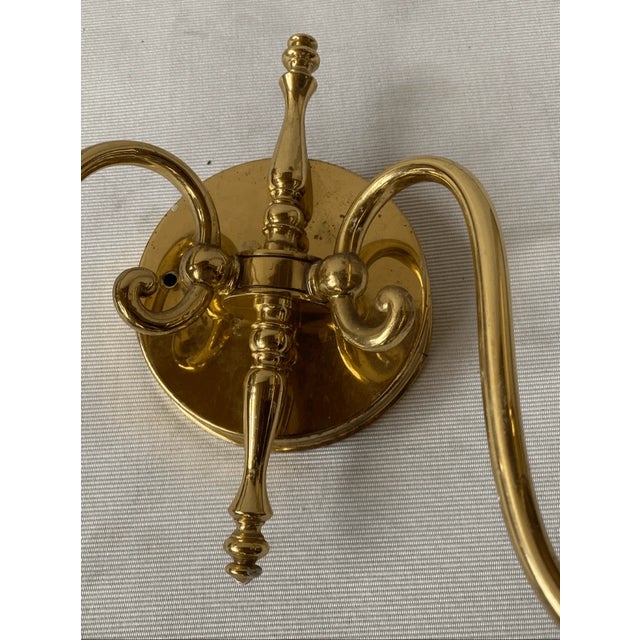 Good condition Add a touch of timeless elegance to your home with this vintage double-arm wall sconce. Crafted from...