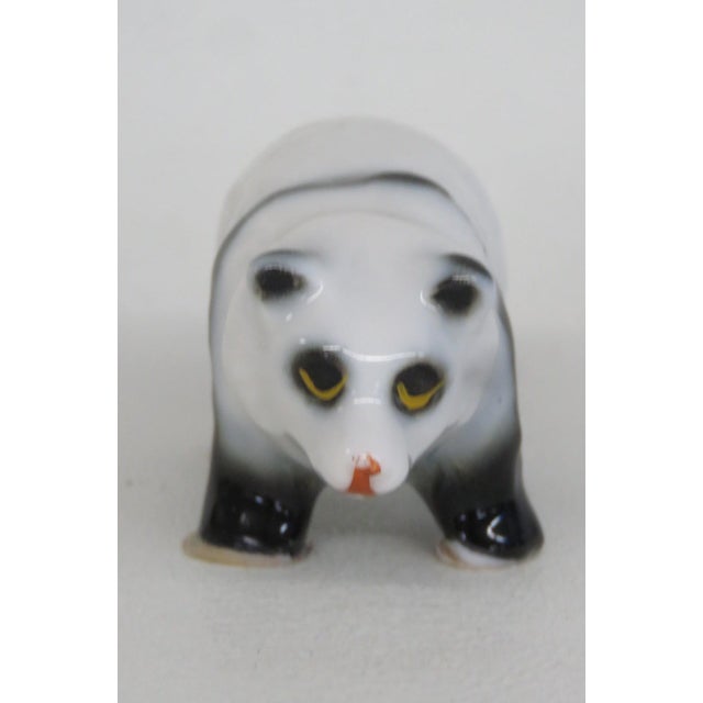 This darling vintage Panda Bear figurine is made of ceramic. This lovely collectible animal figurine features a panda...