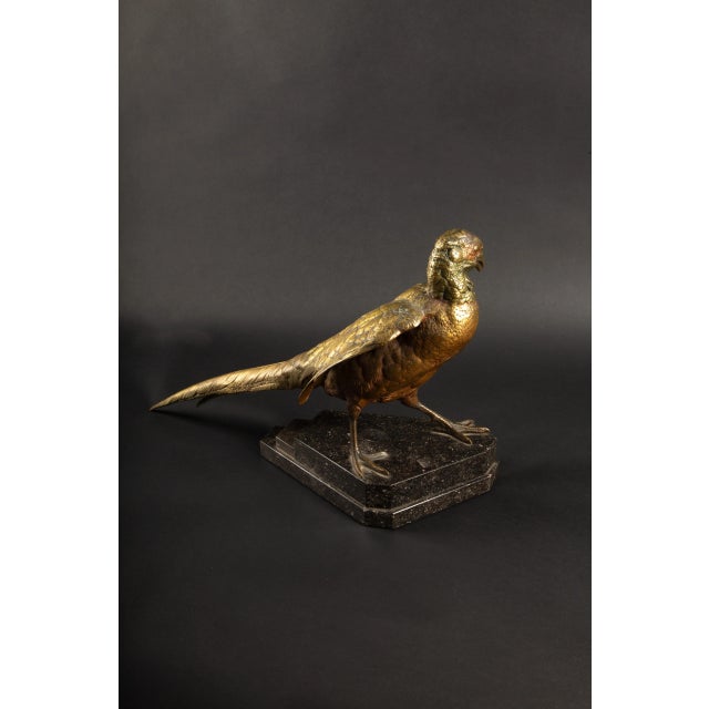 JULES MOIGNIEZ (1835-1894) Pheasant A magnificent large bronze sculpture with a gilded patina, mounted on a tiered black...