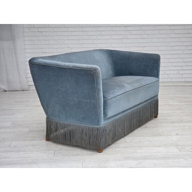1970s, Danish 2-seater sofa. Original blue furniture velour, oak wood legs, springs in the seat. Original very good...