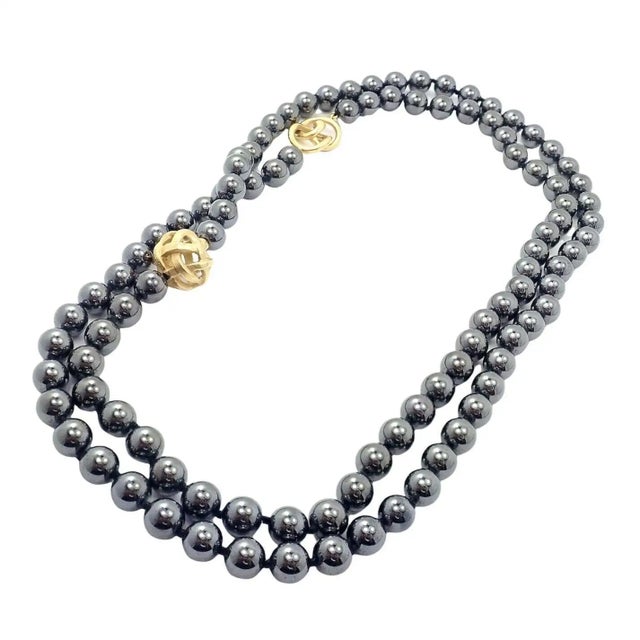 Angela Cummings 18k yellow gold hematite 38" long bead necklace. *Can be worn single or double strand Details: Metal: 18k...
