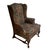Elegant floral patterned wingback chair with wooden legs. A sturdy piece in nice condition, ready for its next life....