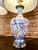 Classic Cloisonné vases converted in to lamps on Lucite bases. The pattern features a "birds and blossoms" theme in mirror...