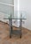 Postmodern side table made of steel and tempered glass! The table is a real statement piece and is in a great condition.