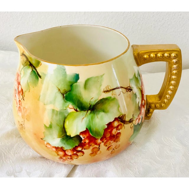 Truly a gorgeous hand painted treasure dating back 100 years, this colorful cider pitcher would be a beautiful addition to...