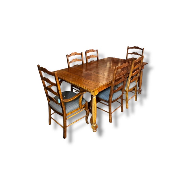 This classic Ethan Allen dining set brings timeless charm and quality craftsmanship to any dining space. The solid wood...