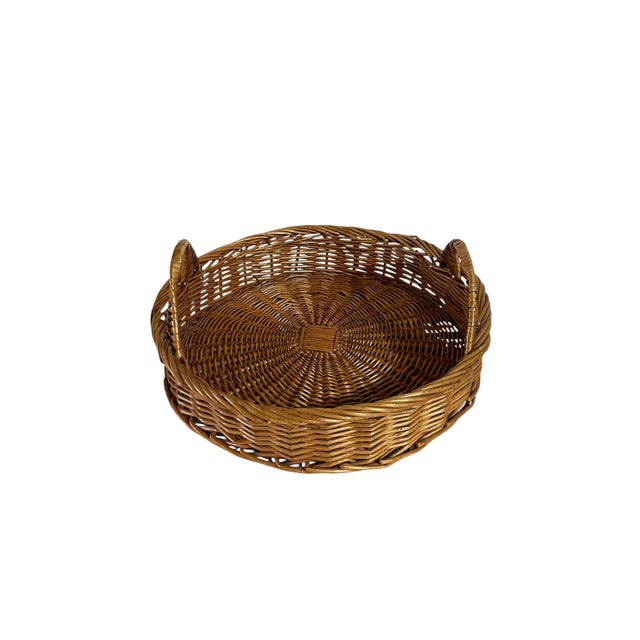 Charming vintage French wicker basket tray with two handles perfect for serving or display. Sourced in France. Height of...