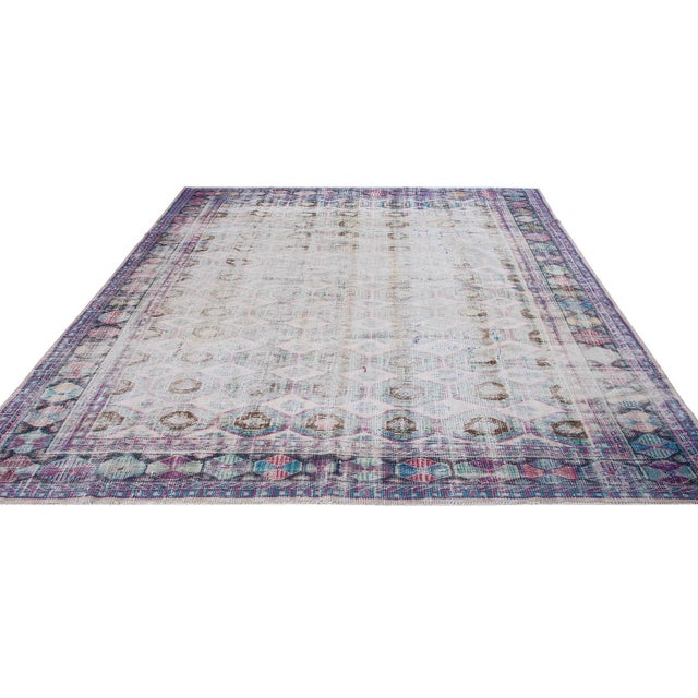 Handknotted vintage wool rug from Oushak region of Turkey. Approximately 65-75 years old. In very good condition.