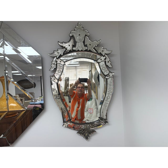 Vintage Venetian Beveled And Etched Mirror. Offered is a glamorous Italian Hollywood Regency etched and beveled Venetian...