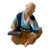Vintage 1950s Made in Japan Chalkware Figurine Elderly Man With Abacus Statue For Sale