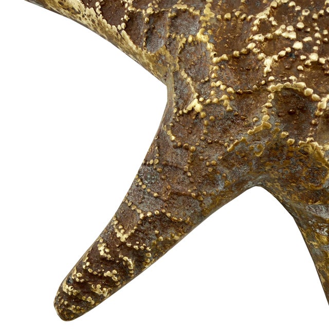 A striking vintage cast-brass starfish sculpture dating to approximately the 1970s. Modeled with five-dimensional arms and...
