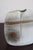 A pebble-form vase in porcelain by virebent, made in france in the 1970s. The body is squared off and split at the top...