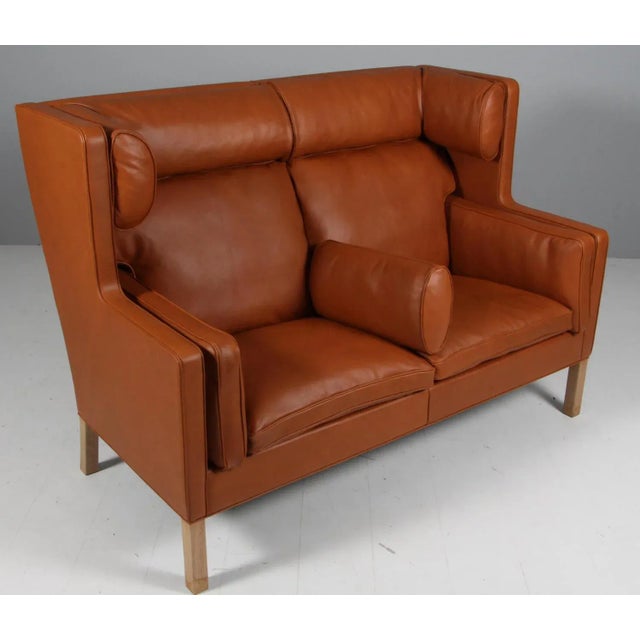 Børge Mogensen new upholstered kupe sofa with walnut elegance leather. Legs of oak. Model 2292, made by Fredericia...