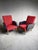 Pair of 1960s armchairs in black vinyl and red fabric / tapered wooden legs with brass feet. Height 83.5 cm. Seat height...