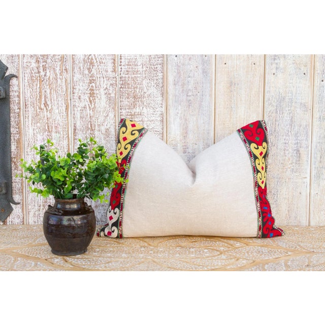 This linen pillow is flanked by rare antique tribal borders, it is bordered by hand-woven, ply-split camel girth lace and...