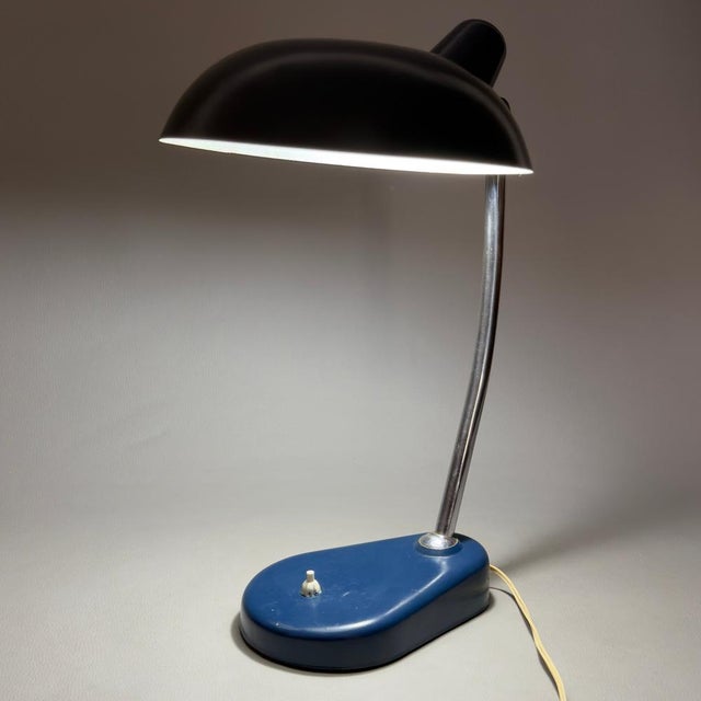 An iconic piece brimming with character, a must-have for true lovers of mid-century Italian design. This rare adjustable...