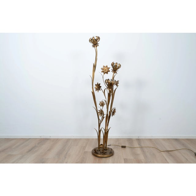 Brass floorlight by Hans Kögl. The light is made out of brass in a hollywood regency style. This piece is attributed to...