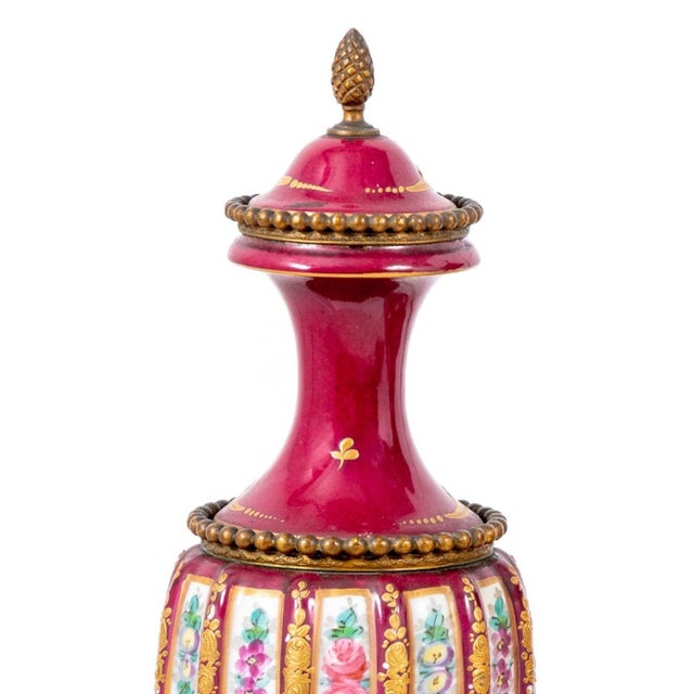 Pair of Sevres Rose du Barry Gilt Metal Mounted Vases, late 19th century, each with a domed top and wyrthen body painted...