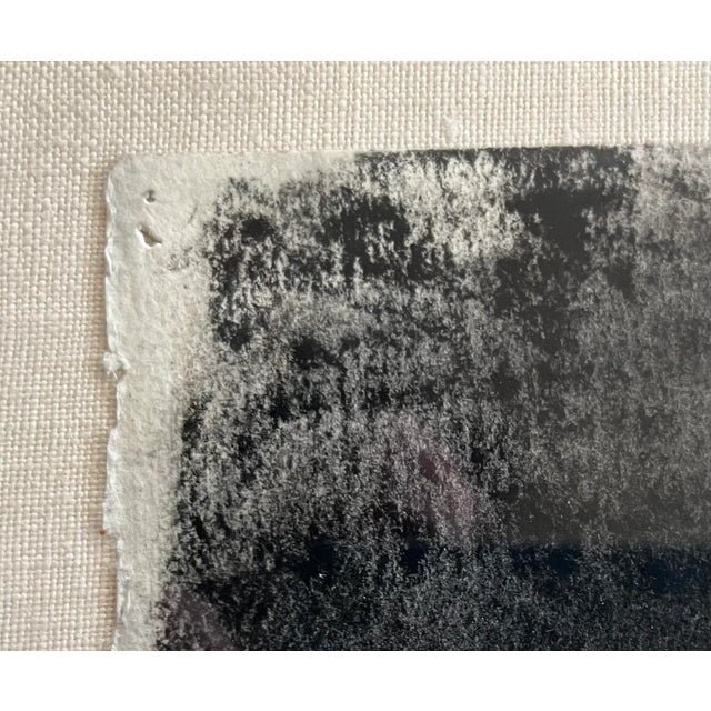 This understated abstract work hails from the 1970s and features organic irregular orbs with a charcoal background....