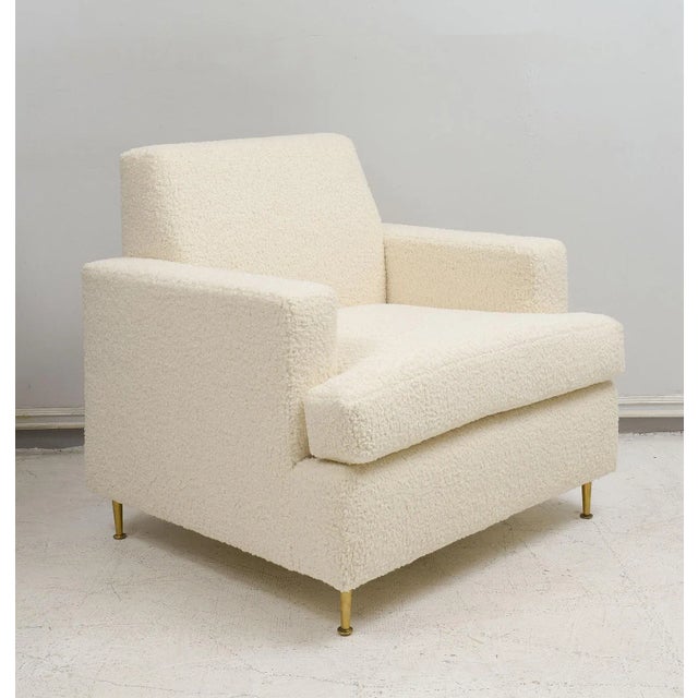 Bespoke Pair of lounge chairs in the Jean Michel Frank Manner upholstered in boucle fabric and with brass legs. Upholstery...