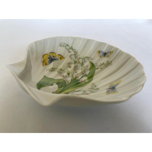 Limoges white porcelain sea shell dish with hand painted lily-of-the-valley and butterfly design, c. mid 20th century,...